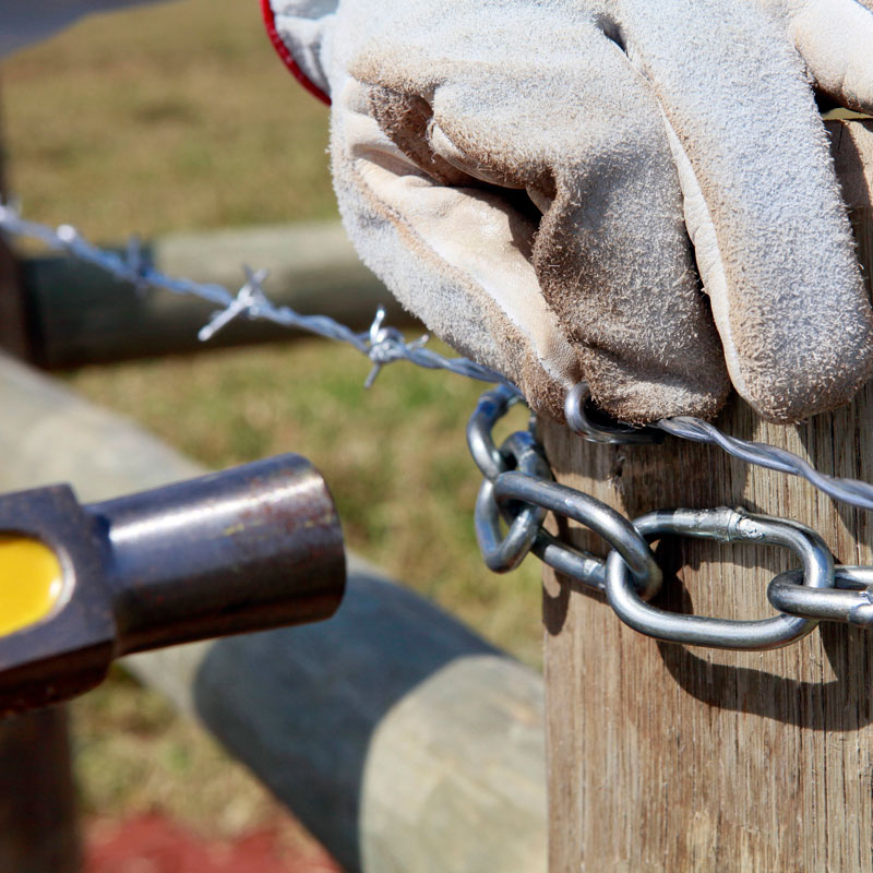 hammer repairing field fence