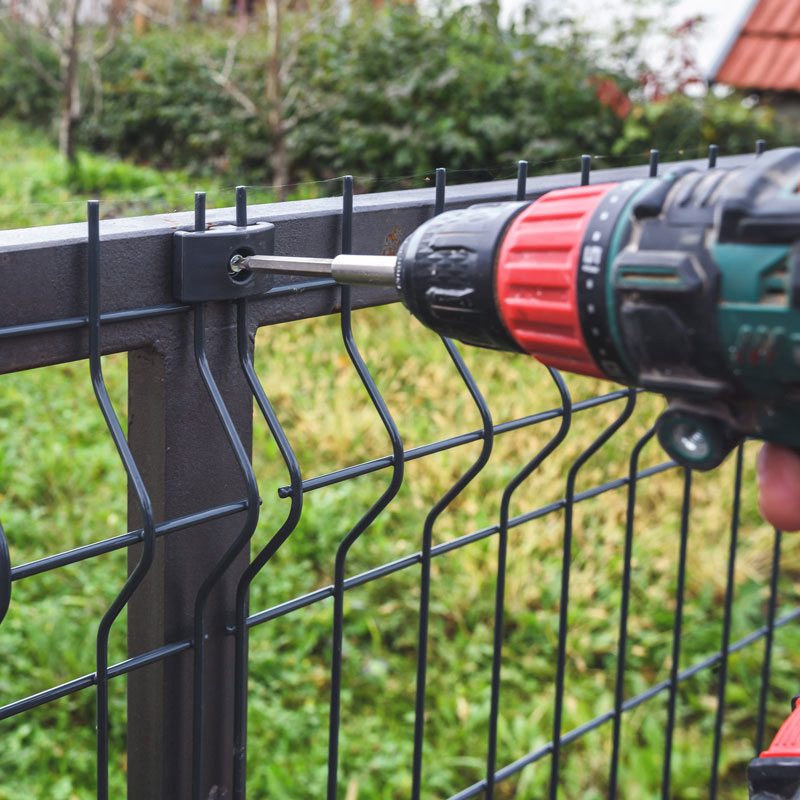 drill repairing fence